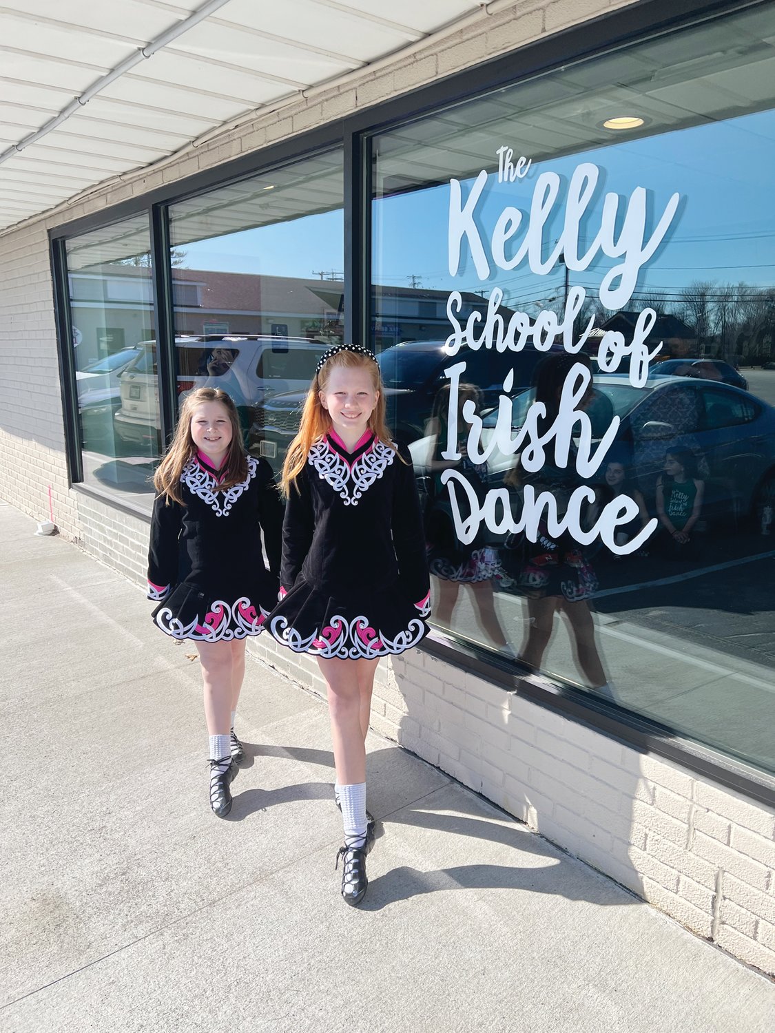 LOOKING FORWARD TO ST. PATRICK’S DAY: KSID dancers Avery Bouvier (left) and Caileen Hughes prepare are preparing their March shows.